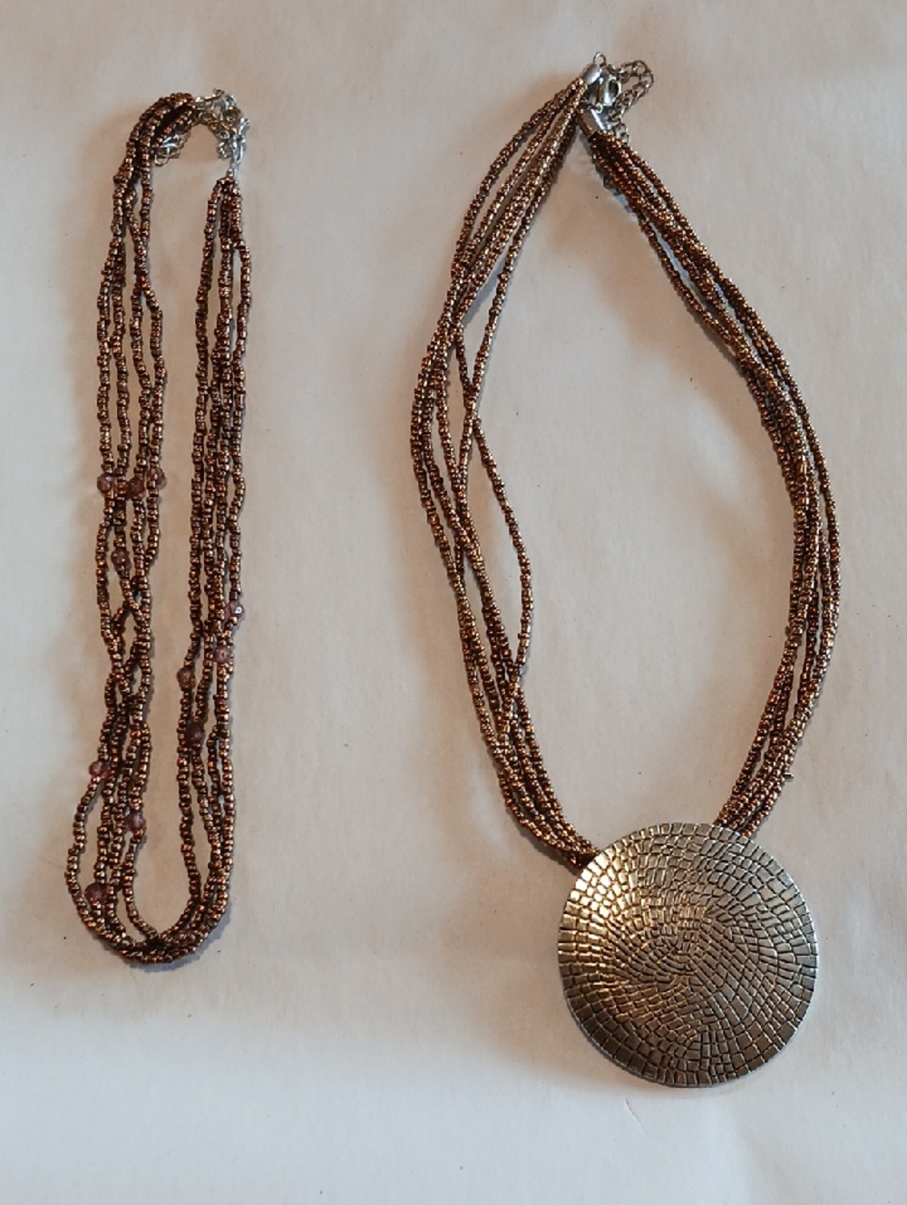 Two Vintage Beaded Multi-Strand Necklaces One with Brasstone Mosaic Pendant